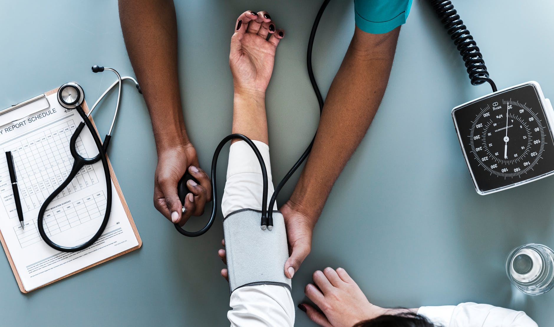 technician taking a patients blood pressure