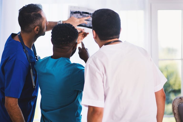 three doctors in a medical setting