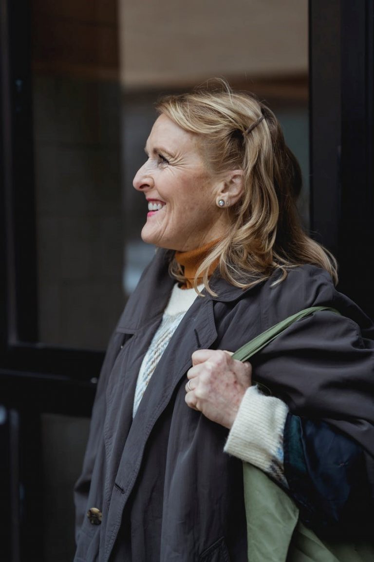 A middle-aged woman smiling