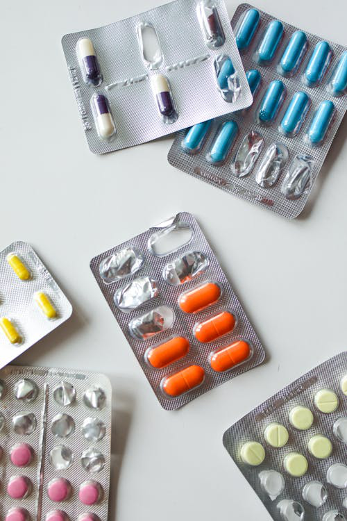 A variety of assorted tablets and pills on a table