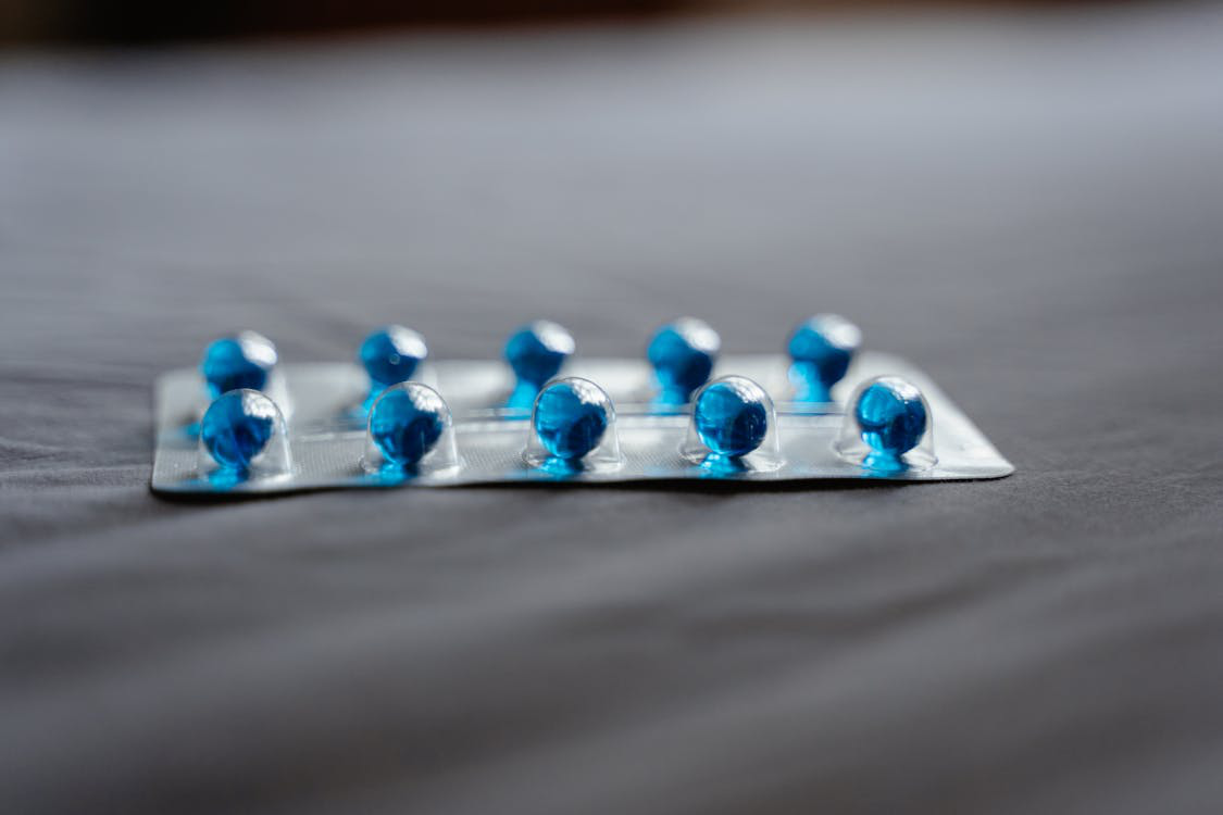 A close-up photo of various medicines in pill bottles