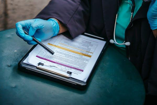 A person checking a patient's medical record