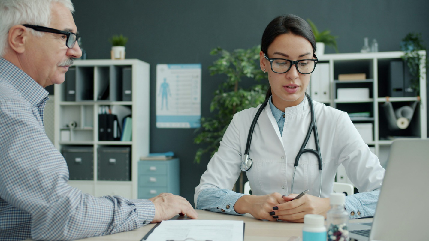 Patient speaking with doctor during consultation in clinic setting