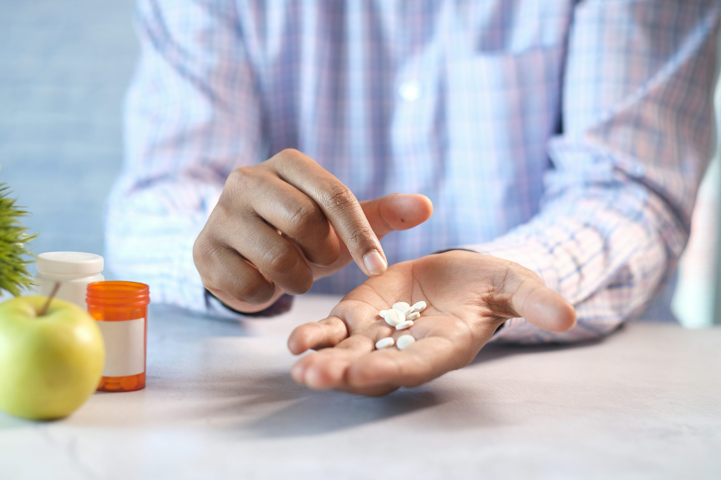 Doctor explaining medication instructions to patient during consultation