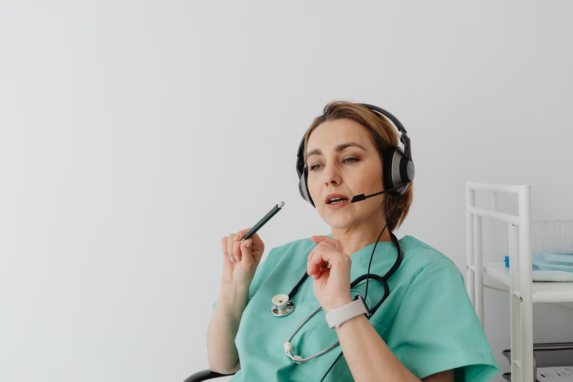 Healthcare professional providing a virtual patient prescription consultation with a headset