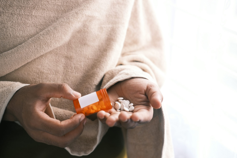 Woman taking prescription medication.