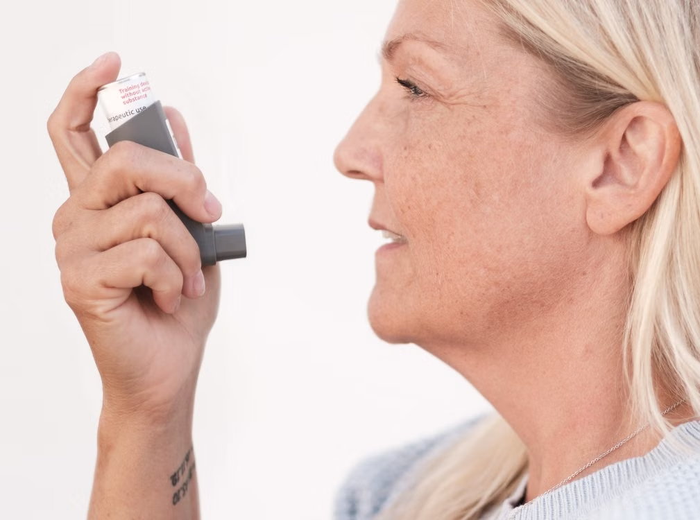 Patient using a prescription inhaler to manage a respiratory condition
